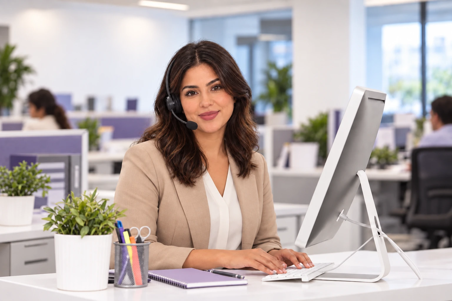 Illustrative case manager seated at a desk with a laptop